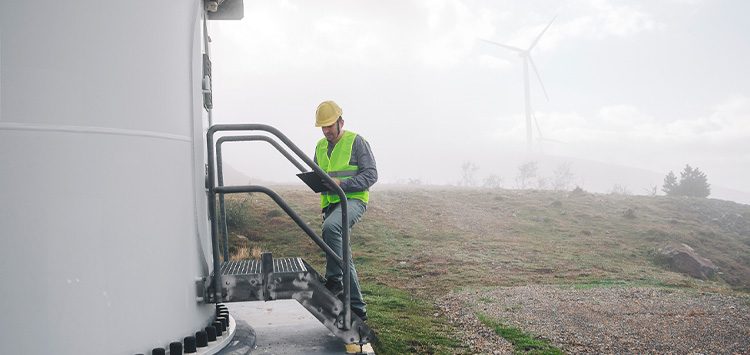 Worker using a mobile personal safety alarm during lone working