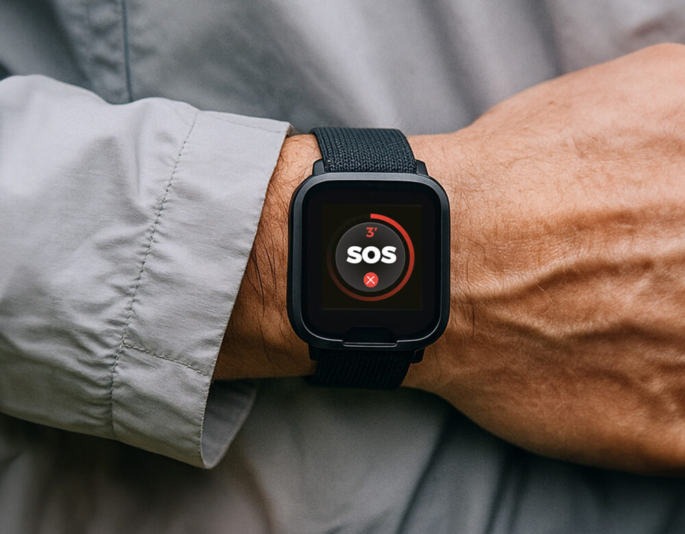 Close up of the MiniFinder Watch SOS button for instant emergency alerts.