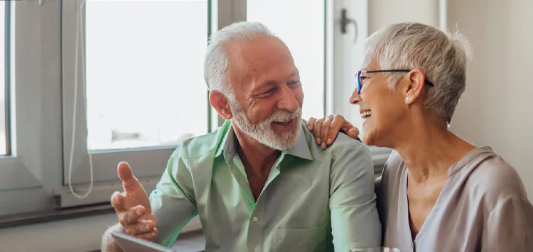 An elderly couple using personal safety alarms in everyday life