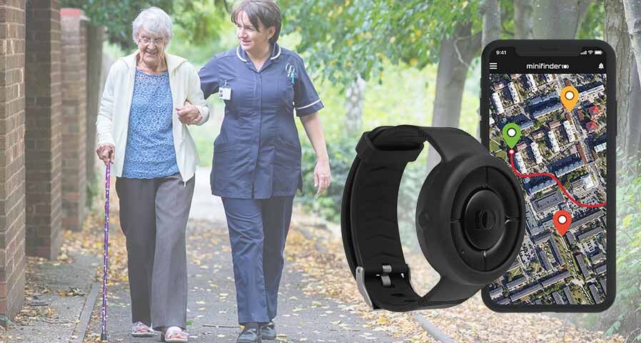 An elderly woman who has fallen using a safety alarm to receive immediate assistance from staff