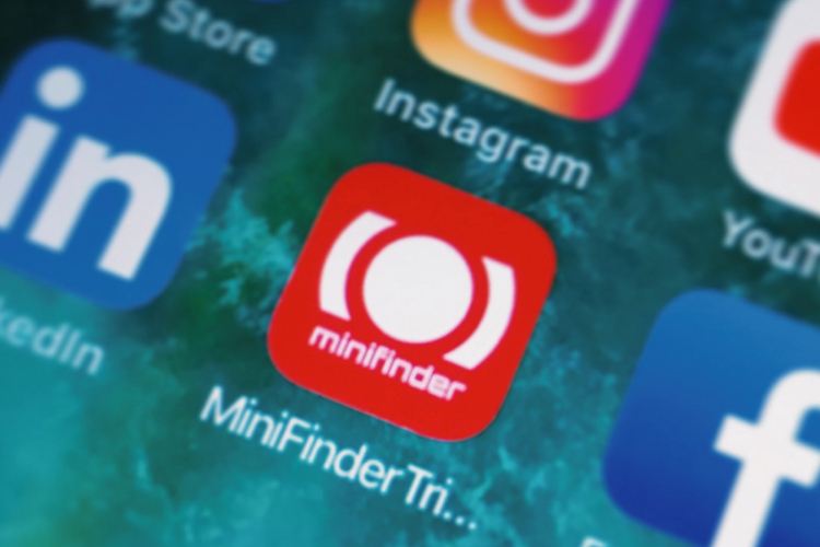 A mobile phone displaying the MiniFinder Triplog app