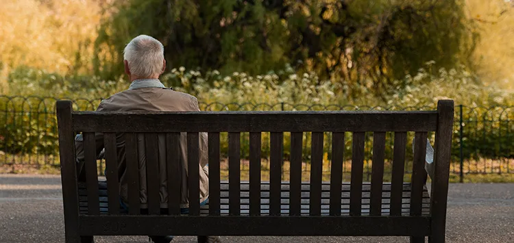 An elderly man with dementia using an emergency gps alarm for added security