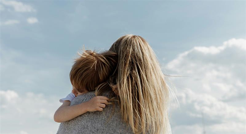 Parent holding their child – safety in everyday life